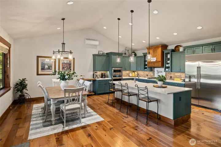 Dining area and kitchen with eating bar.