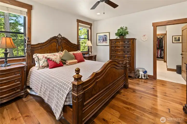 Hardwood floors continue into the primary suite.
