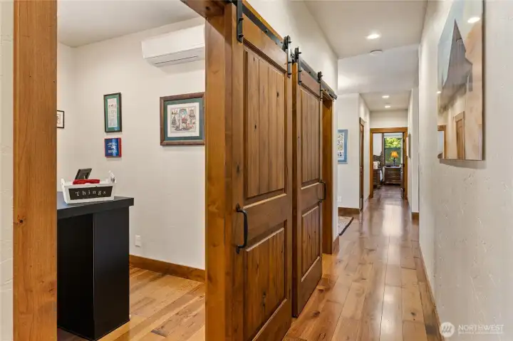 Sliding barn doors serve the craft room and pantry.