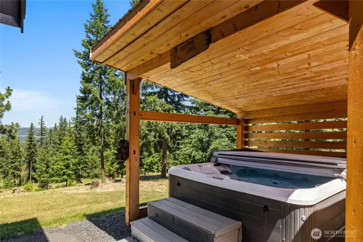 Hot tub is located just off the back deck.