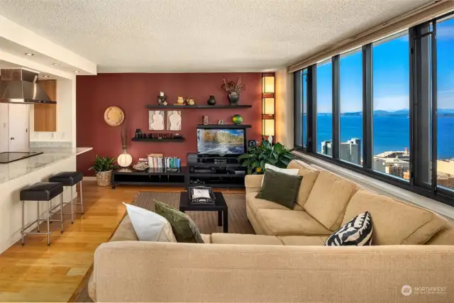 Inviting living room with warm bamboo floors and fantastic views of Puget Sound and the Olympic Mountains.