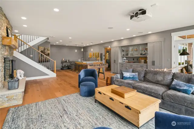 Lower level includes rec room, a wet bar, wine cellar, and bedroom. Zinc bar top on lower level, wrapped with reclaimed wine barrel wood. Bar includes a 35 bottle wine cooler, ice maker & dishwasher.