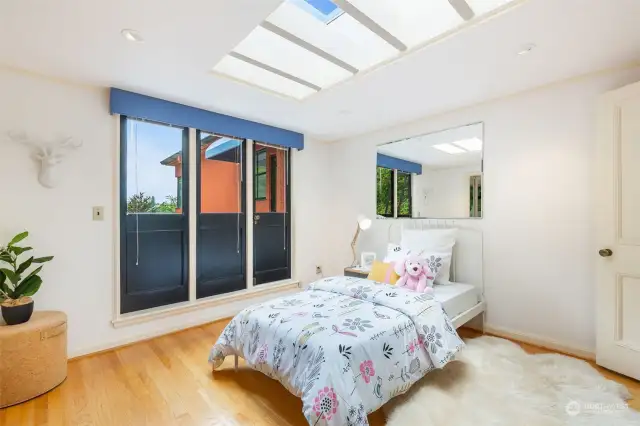 Middle bedroom with a door to access the roof top deck