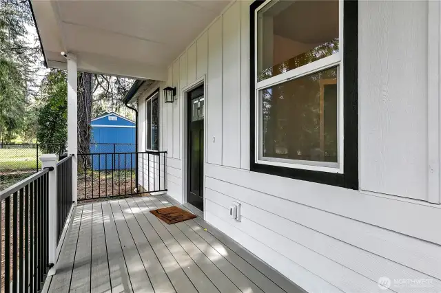 Covered Front porch leads to the entrance.