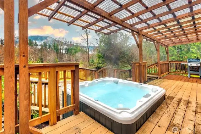 The hot tub on the deck is perfect for all year round