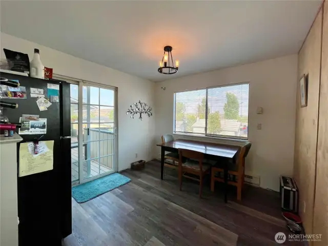 The kitchen nook has lots of space and a slider to the deck.