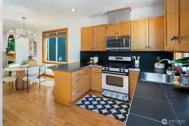 Chef's kitchen has abundant storage, stainless appliances and good work space.  Hardwood floors are found throughout.
