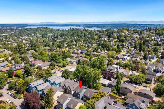 Aerial view of house and the surrounding city environment - Lake Washington in the distance