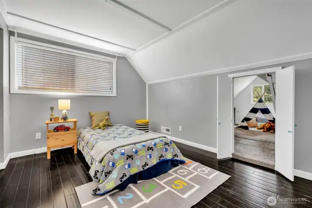 This upstairs bedroom has a fun access point to...