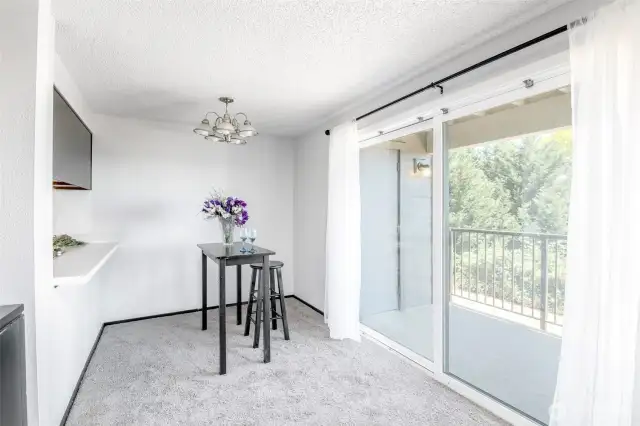 Dining room with a barstool counter to the kitchen.