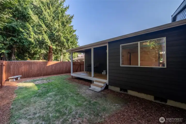 Fully fenced back yard with private deck.