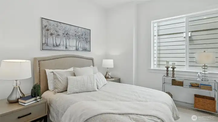 Main Level Guest Suite:  The main-level guest suite offers privacy and convenience as well as an attached private bathroom - ideal for multi-generational living or long-term visitors.