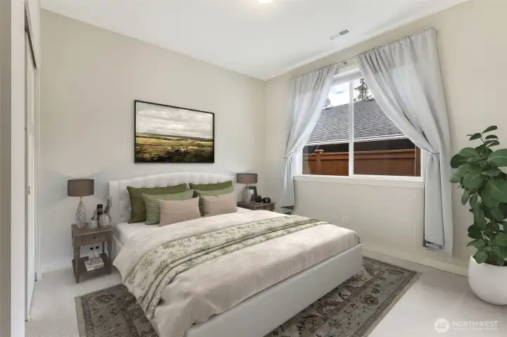 Flexibility is one of this home's superpowers, and this room is a great example. While it functions beautifully as a second guest bedroom, its location near the foyer and shared access to the main bathroom also make it an ideal den, media room, office or craft space. One particularly thoughtful feature of this floorplan is that no bedroom shares a wall with another bedroom, helping create a quieter and more private living experience throughout the home. Combined with the split-bedroom layout, everyone gets a little extra breathing room.