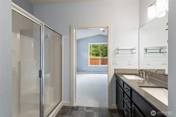 Gorgeous views from the primary bathroom straight out to the greenery of nature awaiting you each morning.  A calming place to gear up for and unwind from the day.