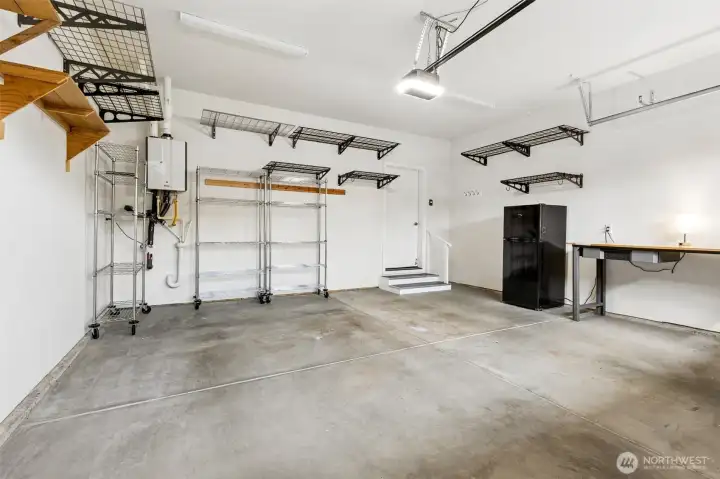 This garage is ready to hit the ground running because so much of the organization work has already been done for you. In addition to the generous storage space, the three rolling shelving units stay with the home along with the overhead hanging storage racks, making it easy to keep seasonal items, tools and hobby supplies neatly organized and off the floor. The garage refrigerator also remains, giving you extra room for beverages, overflow groceries or holiday entertaining needs, and for anyone who appreciates a well-organized workspace, the included Kobalt workbench and matching Kobalt rolling tool cabinet create an excellent setup for projects, repairs or simply having a place for everything.