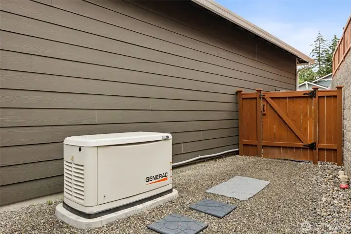 Luxury isn't always about chandeliers and fancy countertops. Sometimes it's knowing the power can stay on when the neighborhood starts searching for flashlights. This home features an installed $17,000 Generac backup power system, offering an extra layer of comfort and security when unexpected outages occur. Surrounding the home, you'll also find thoughtfully placed pavers and rock landscaping that not only look attractive but help reduce muddy pathways and keep outdoor walking areas cleaner and more accessible year-round. It's a great example of the kind of practical, well-considered upgrades that quietly make everyday life easier while adding long-term value to the property.