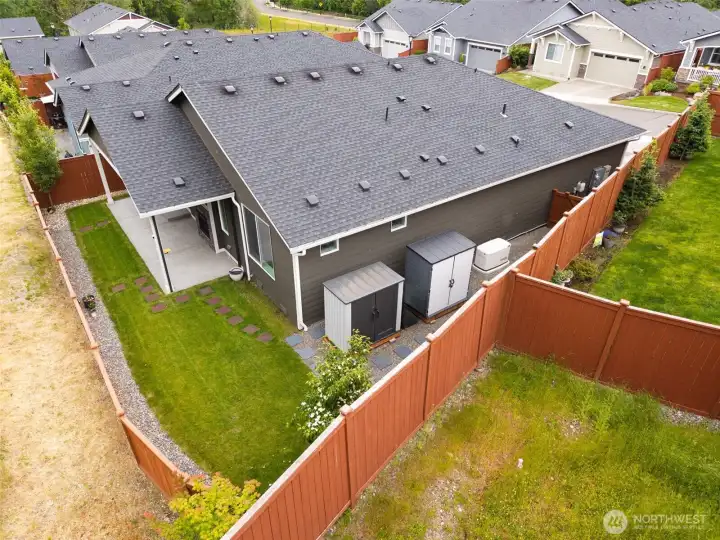 Not every home's upgrades are exciting enough to earn their own aerial photo, but these are worth mentioning. Two storage sheds remain with the property, creating extra room for hobbies, gardening equipment, tools and seasonal items without sacrificing valuable garage space. You'll also notice the GENTRAC full house generator system. It's the kind of improvement you may not think about during most PNW weather, but will absolutely appreciate if the lights go out!