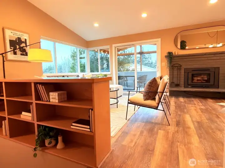 Maple bookshelves grace the stairway into the living room.