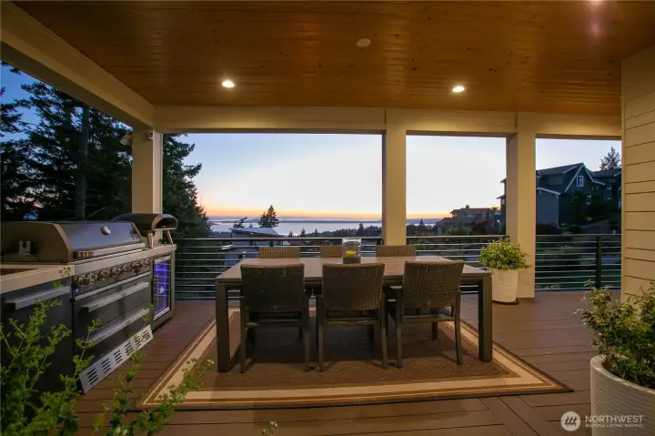 Enjoy dining al fresco anytime of the year on the covered deck with easy access to the kitchen.