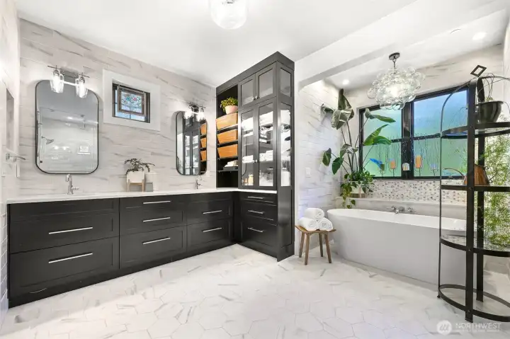 Heated tile floors, designer lighting and the soaker tub come together to create your very own spa-like experience.