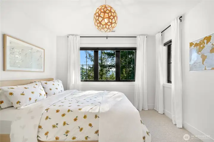 This bedroom has views of Lake Padden and features a full en-suite bath with a shower/tub combo.