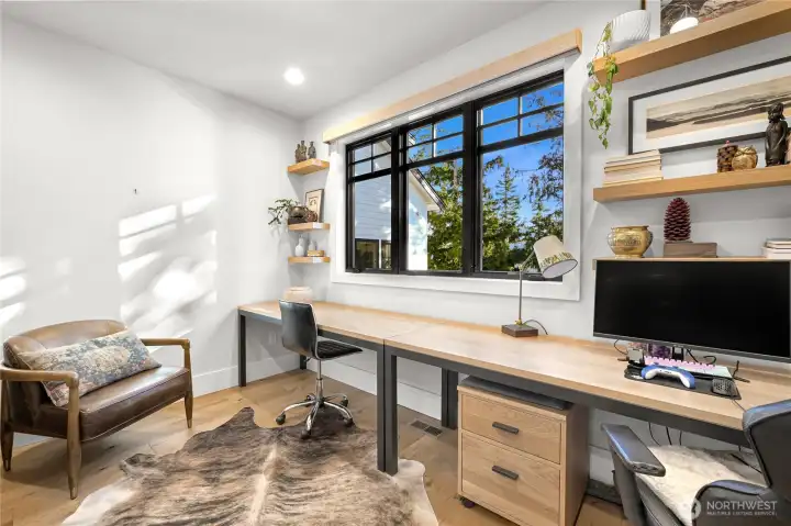 Dedicated office space on the main floor with french doors.