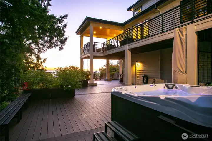 Extensive TimberTech decking surrounds much of the home. Coast Spas 8-person hot tub included.