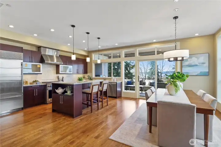 Chef-inspired kitchen with high-end appliances, new lighting, refinished marble counters and new marble backsplash.