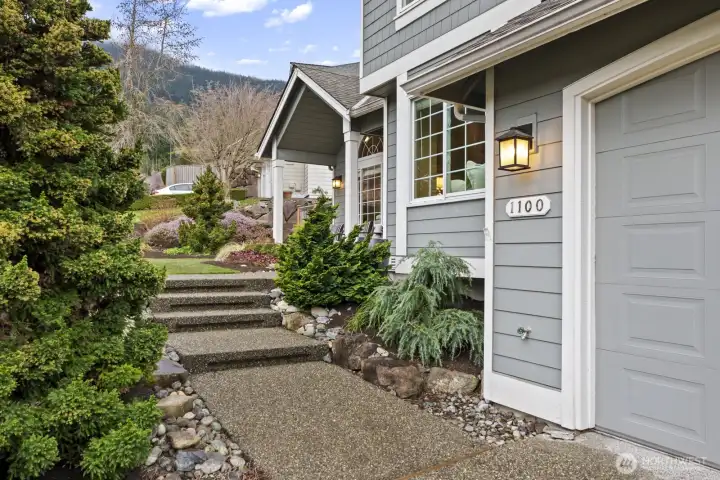 The path to your new Forster Woods home is beautifully framed by professionally sculpted landscaping.