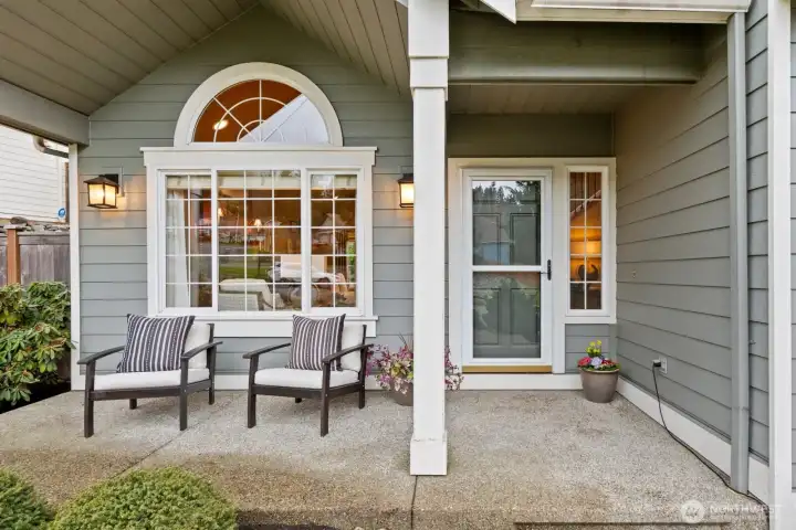 The inviting, covered front porch is perfect for taking in the neighborhood or welcoming guests.