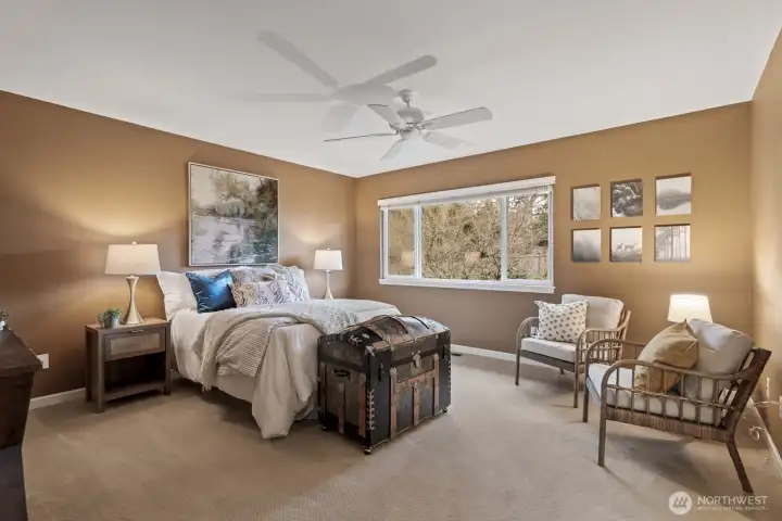 Unwind in the expansive primary suite—a peaceful retreat at the end of a long day.