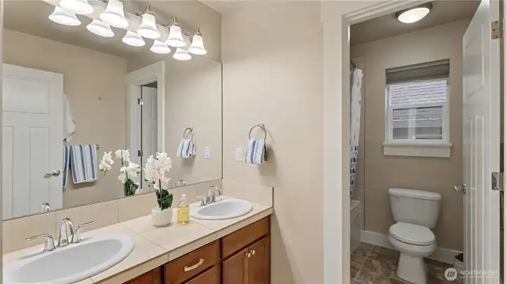 This upper-level guest bath offers a spacious vanity and a tub/shower combo for everyday convenience.