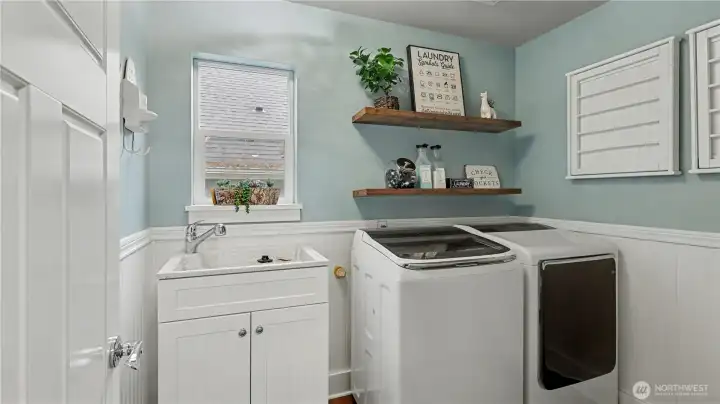 Convenient upper-level laundry room designed to make everyday tasks simple and efficient.