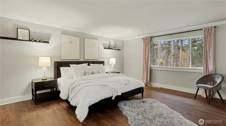 This light-filled primary retreat provides the perfect place to recharge and unwind.