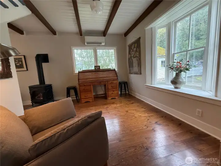 Beamed ceilings continue through the family room.