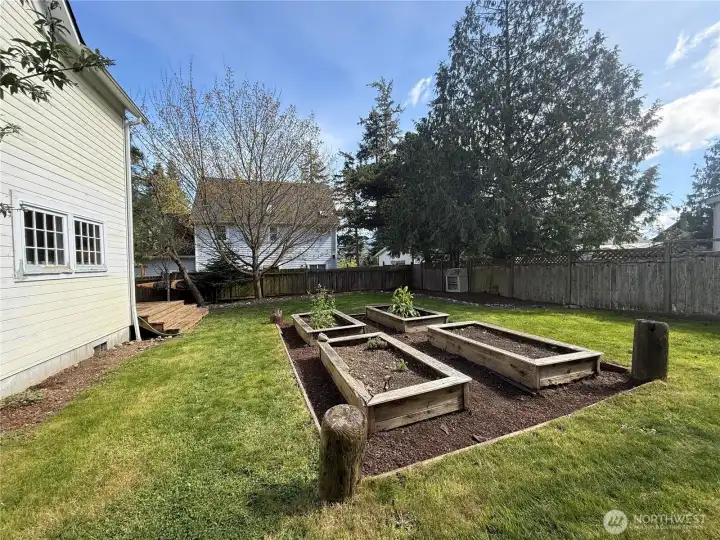 Raised garden beds for vegetables and flowers.