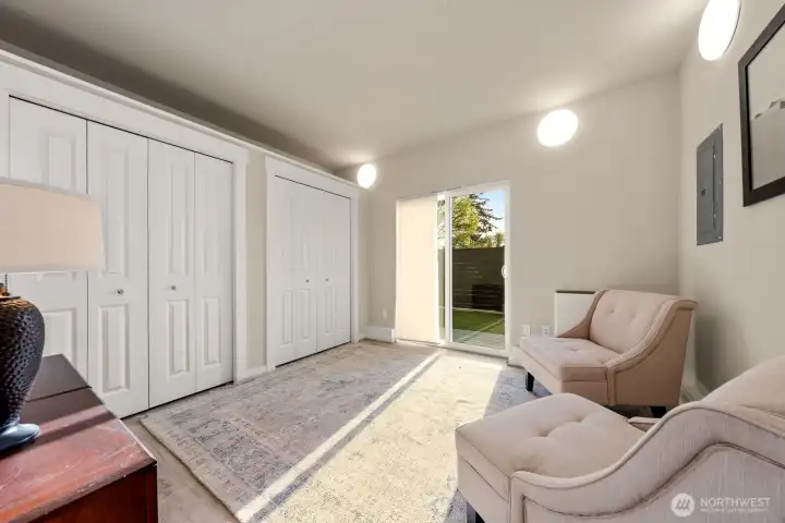 lower level bedroom 2, direct access to fully fenced backyard.