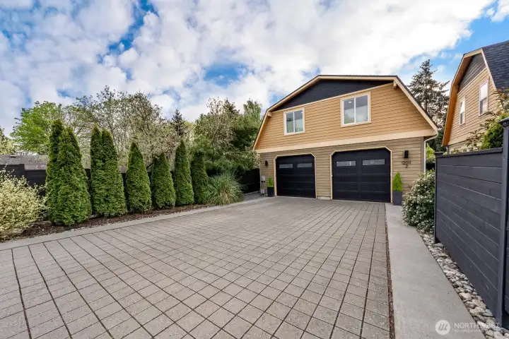 Parking area, attached garage on the left with access to home. 1 parking spot in driveway.