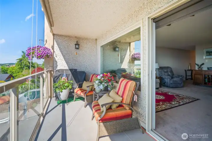 Spacious balcony allows for seating and also bbq.