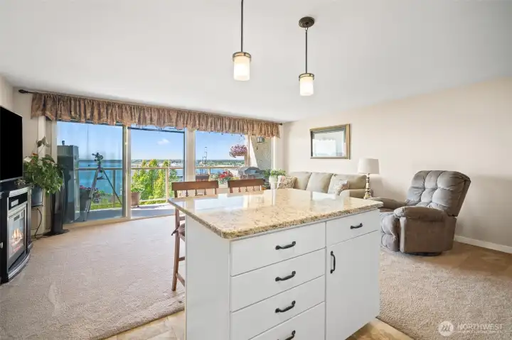 Kitchen island and living room - large windows for the view.