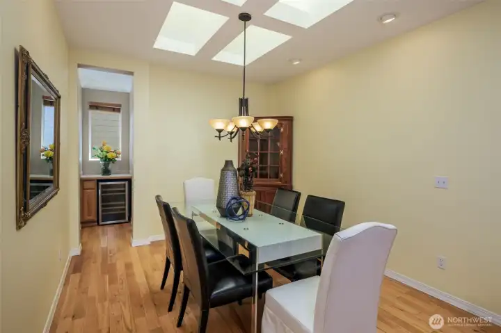 View of the dining room to the butler's pantry and wine fridge.