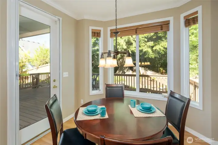 Breakfast nook overlooks the deck and golf course.