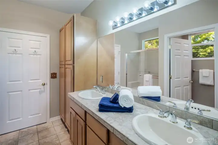 Spacious primary bathroom with separate toilet area.