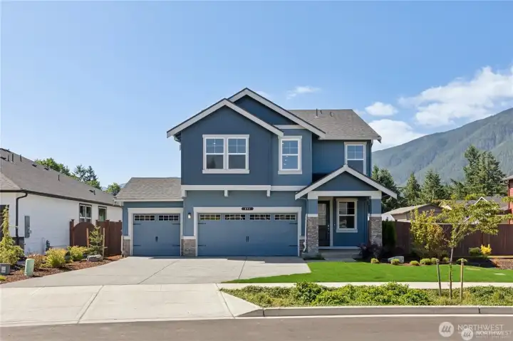 With expansive driveways and three car garages you'll have lots of parking for your family and friends. Photo rendering is representational and may be virtually staged. Actual home is under construction and finishes, elevation, and paint colors may vary. See site agent for details.