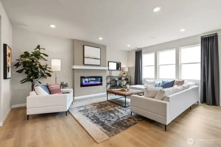 Windows to the west inviting the outdoors in with lots of natural light. Photo rendering is representational and may be virtually staged. Actual home is under construction and finishes, elevation, and paint colors may vary. See site agent for details.