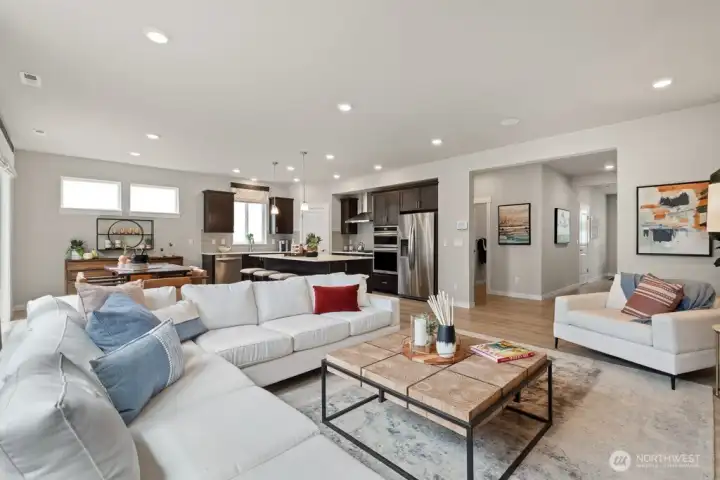 Hard surface flooring throughout the main floor. Photo rendering is representational and may be virtually staged. Actual home is under construction and finishes, elevation, and paint colors may vary. See site agent for details.