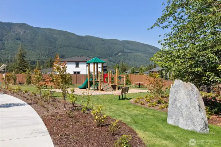 Community park at entrance of community. Photo rendering is representational and may be virtually staged. Actual home is under construction and finishes, elevation, and paint colors may vary. See site agent for details.