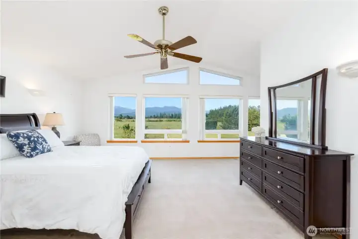 High ceilings and abundant light make this a welcoming primary bedroom suite. High ceilings and abundant light make this a welcoming primary bedroom suite.