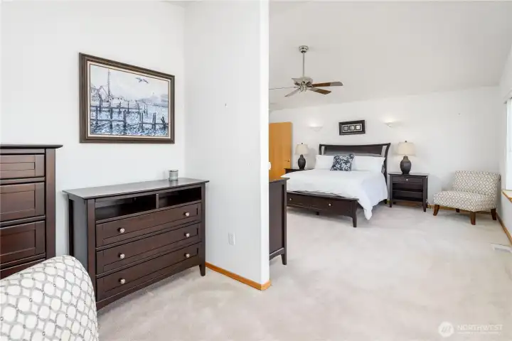 Primary bedroom from sitting area. Primary bedroom from sitting area.