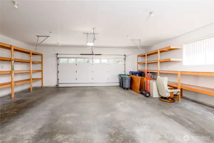 Attached garage with built in shelving. Attached garage with built in shelving.